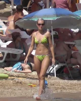 Candid chicks walking on the beach in sexy bikinis