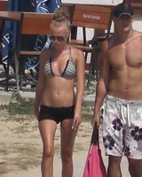 Candid chicks walking on the beach in sexy bikinis