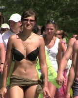 Candid chicks walking on the beach in sexy bikinis