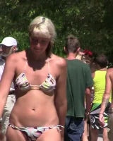 Candid chicks walking on the beach in sexy bikinis