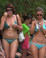 Candid chicks walking on the beach in sexy bikinis