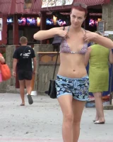 Real candid girls in bikinis walking on the streets