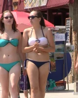 Real candid girls in bikinis walking on the streets