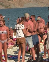 Candid girls with sexy bodies walking on the beach