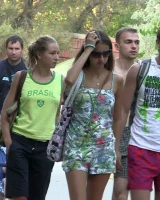 Candid girls with sexy bodies walking on the beach