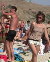 Candid girls with sexy bodies walking on the beach