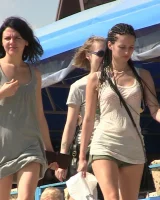 Candid girls with sexy bodies walking on the beach