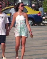 Candid girls with sexy bodies walking on the beach