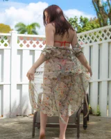 Orange micro bikini redhead is in the backyard with puffy nipples