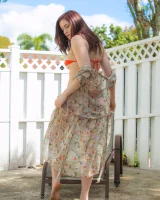 Orange micro bikini redhead is in the backyard with puffy nipples