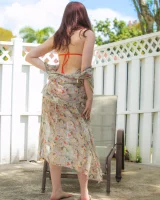 Orange micro bikini redhead is in the backyard with puffy nipples