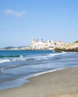 Busty beach bunny in red bikini going nude