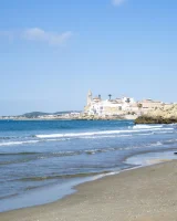 Busty beach bunny in red bikini going nude