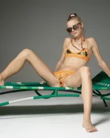 Cute slim body girl in sexy motley bikini