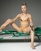 Cute slim body girl in sexy motley bikini