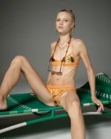 Cute slim body girl in sexy motley bikini