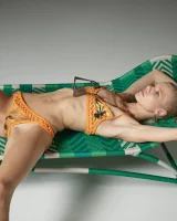 Cute slim body girl in sexy motley bikini