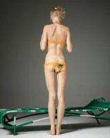 Cute slim body girl in sexy motley bikini