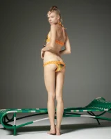 Cute slim body girl in sexy motley bikini