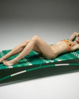 Cute slim body girl in sexy motley bikini