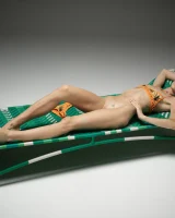 Cute slim body girl in sexy motley bikini