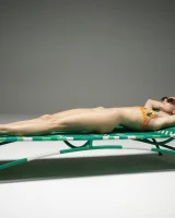 Cute slim body girl in sexy motley bikini