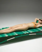 Cute slim body girl in sexy motley bikini