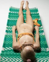 Cute slim body girl in sexy motley bikini