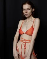 Busty hottie in orange bikini