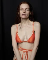 Busty hottie in orange bikini