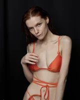 Busty hottie in orange bikini