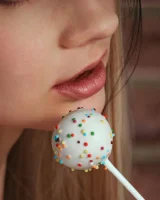 Puffy nipples blonde baby is wearing orange micro bikini