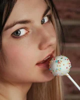 Puffy nipples blonde baby is wearing orange micro bikini