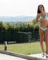 Sexy busty brunette in bikini