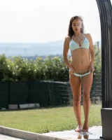 Sexy busty brunette in bikini