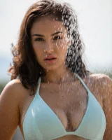 Sexy busty brunette in bikini