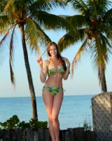 Puffy nipples baby wearing bikini is in the backyard going nude to discover her large labia