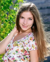 Cute teen Vivian puts the focus on her landing strip twat while naked outdoors