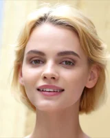 Slim body brunette beauty in motley bikini goes nude by the pool