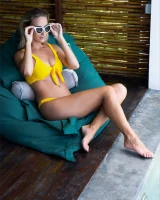 Sexy puffy nipples chick is chillin by the pool in yellow bikini