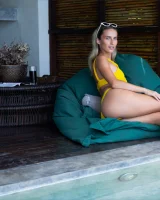 Sexy puffy nipples chick is chillin by the pool in yellow bikini