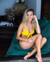 Sexy puffy nipples chick is chillin by the pool in yellow bikini