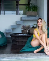 Sexy puffy nipples chick is chillin by the pool in yellow bikini