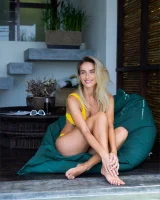 Sexy puffy nipples chick is chillin by the pool in yellow bikini