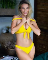 Sexy puffy nipples chick is chillin by the pool in yellow bikini