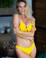 Sexy puffy nipples chick is chillin by the pool in yellow bikini