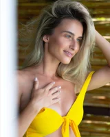 Sexy puffy nipples chick is chillin by the pool in yellow bikini