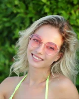 Busty puffy nipples blonde appears in sexy pink bikini poolside