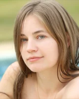 Perfect beautiful teen is by the pool in blue bikini and nude