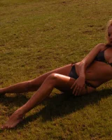Blonde beauty is by the lake in sexty bikini